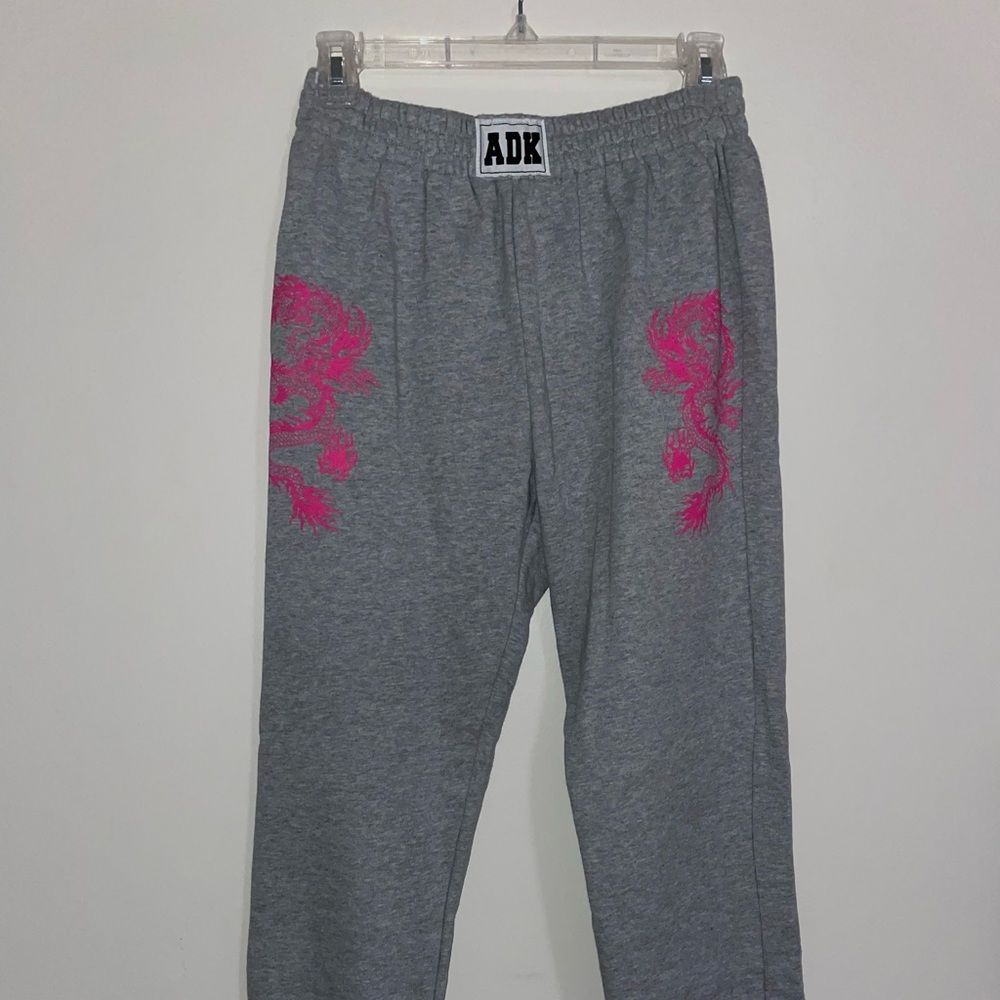 Grey sweatpants with pink dragon from adika
